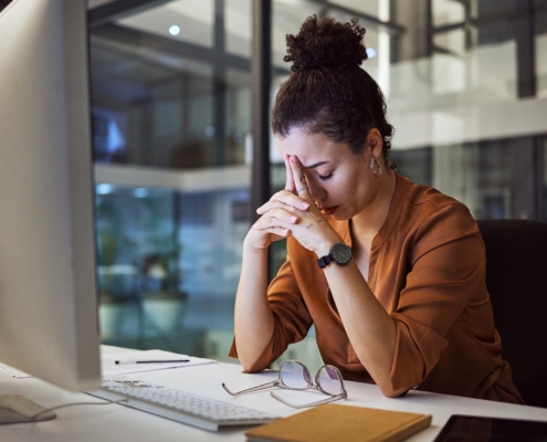 person stressed at office computer