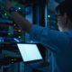 Computer engineer is setting up network in server room