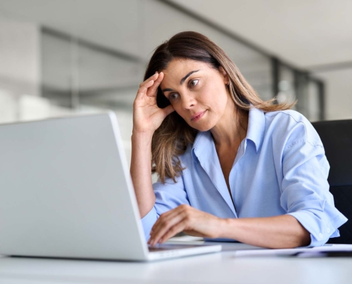 person stressed at computer