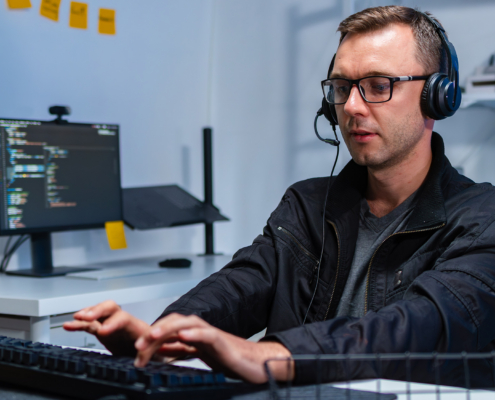 Male IT Support Agent Providing Professional Assistance to a Customer During a Live Support